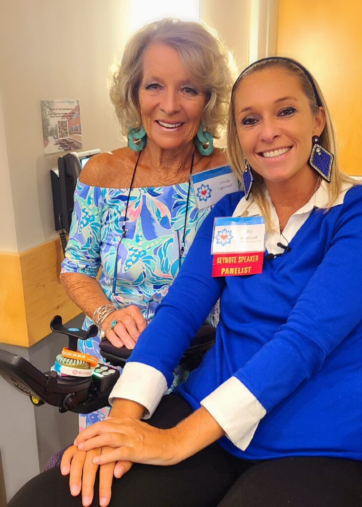 picture of Ali and mother dressed up in bright blue colors at ALS conference
