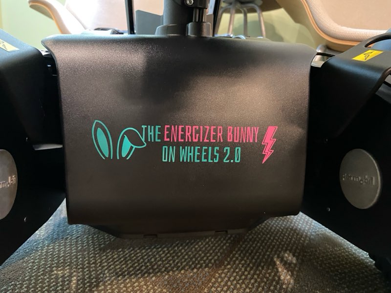 picture of back of wheelchair with the energizer bunny on wheels 2.0 logo