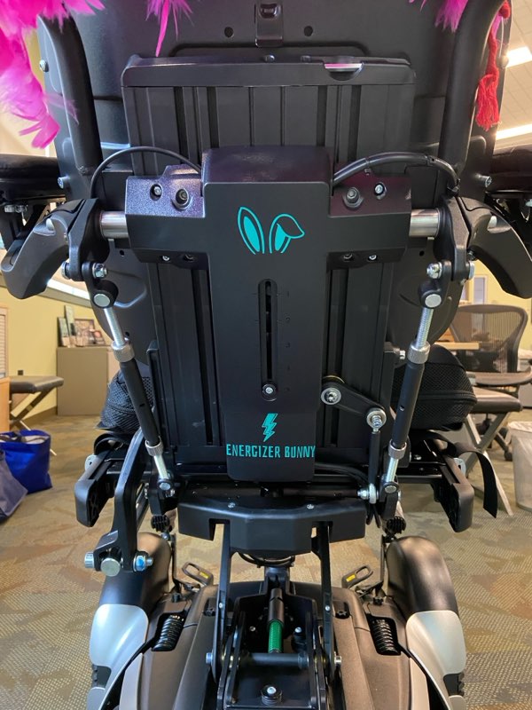 image of Ali new permobil power chair with Energizer by the logo from the back
